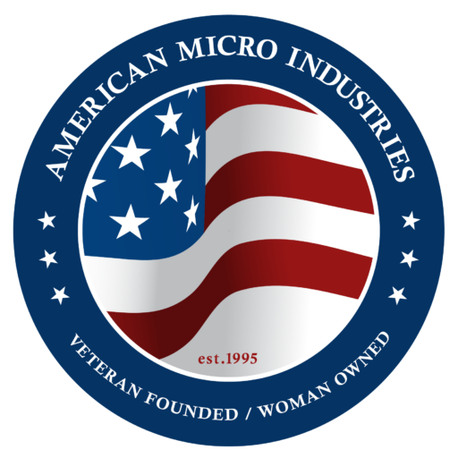 American Micro Industries circular seal with stylized U.S. flag, “Veteran Founded / Woman Owned” and “est. 1995” text