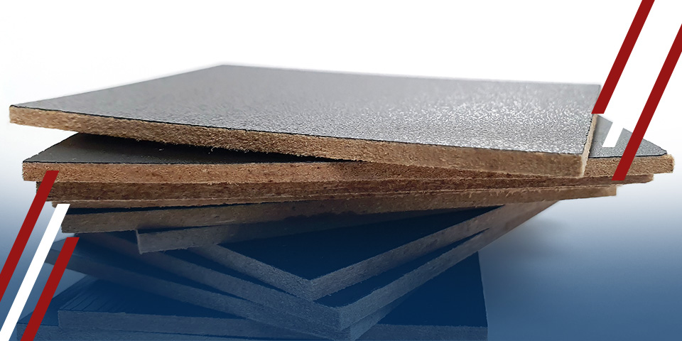 Stacked phenolic laminate sheets with textured gray surface and brown fiber edges on a clean background